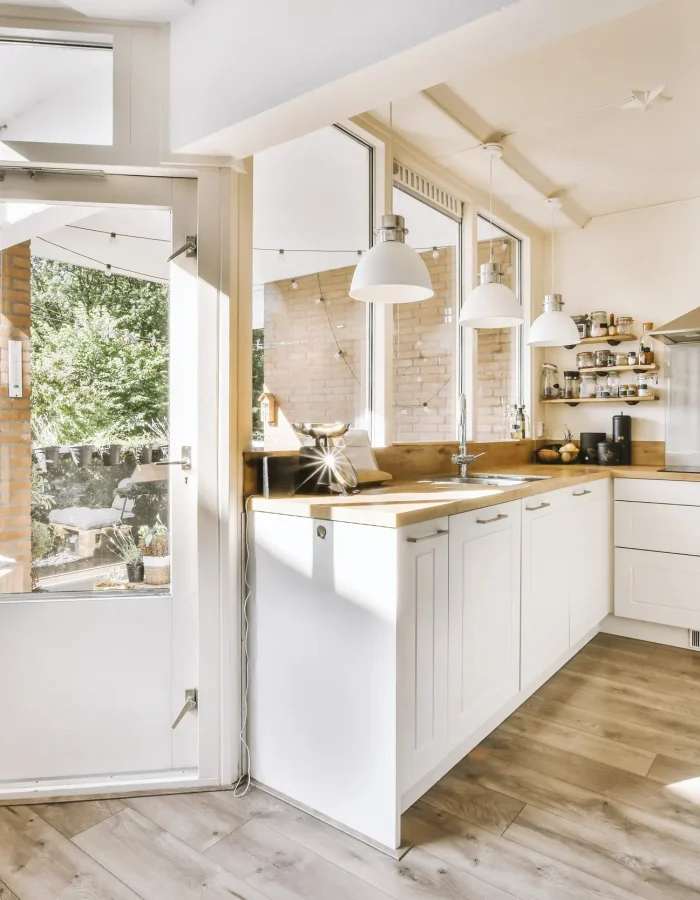 A corner kitchen with white modern concept apartment.