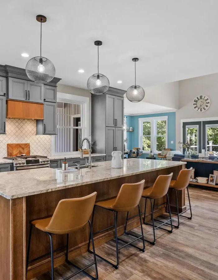An interior design of a beautiful kitchen with a large countertop.