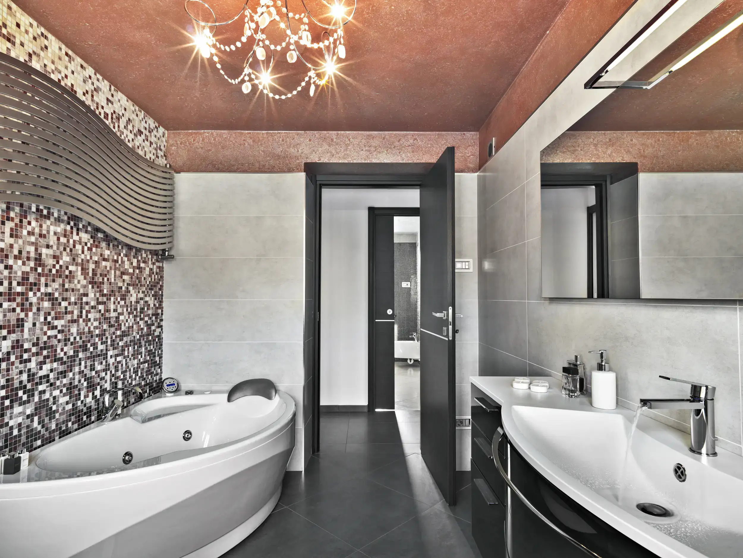 An interior of a modern tiled bathroom.